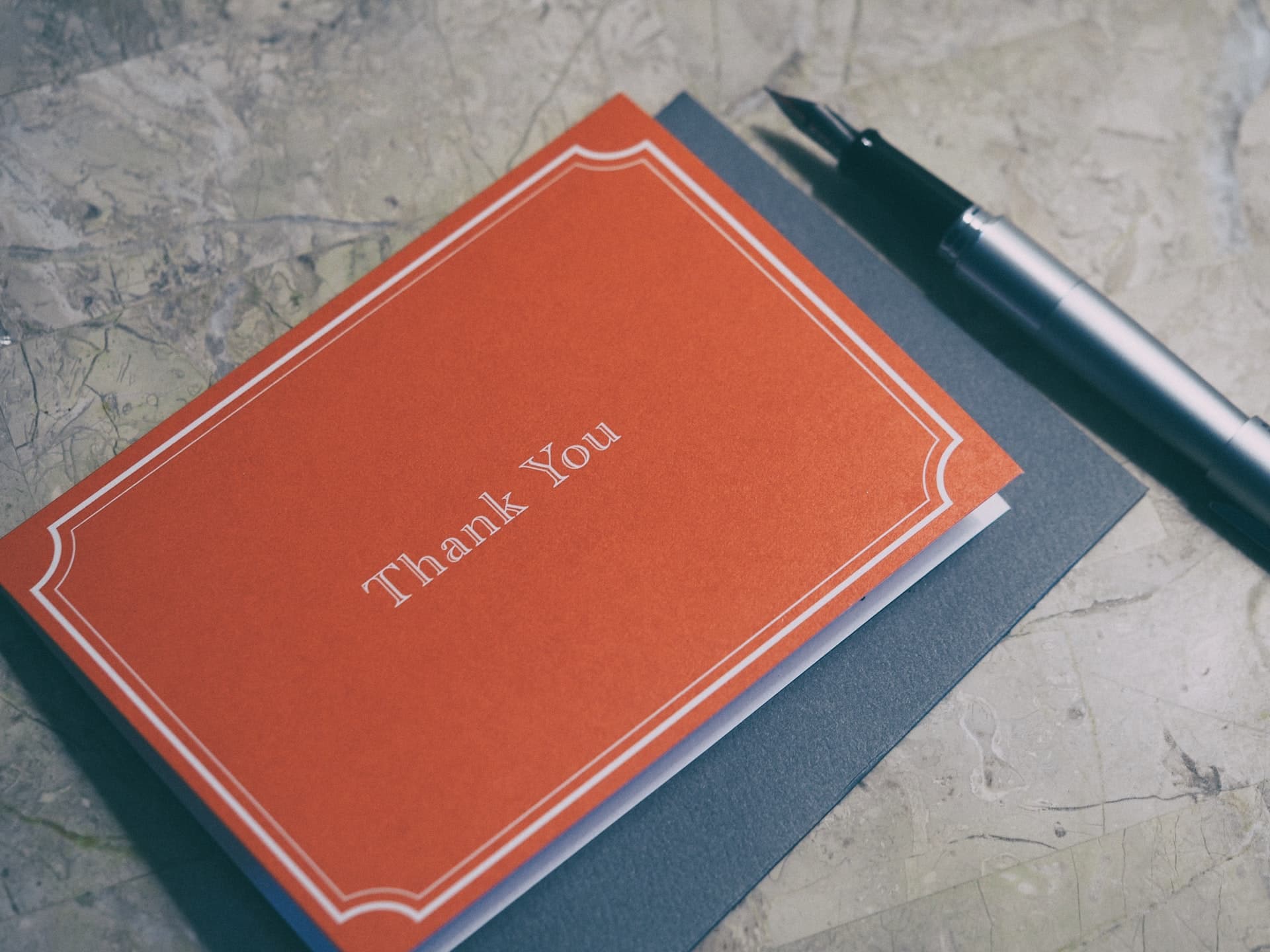 Red Thank You card and a fountain pen